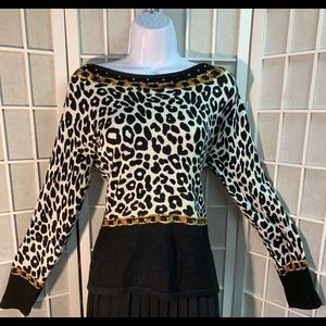 Snow leopard and gold link boat-neck sweater.